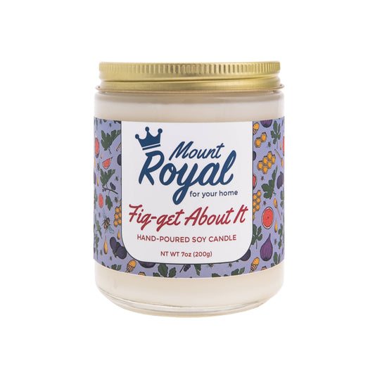 Mount Royal Soaps - FIG-GET ABOUT IT Candle in an elegant glass jar, glowing warmly with fig, brown sugar, and vanilla orchid accents