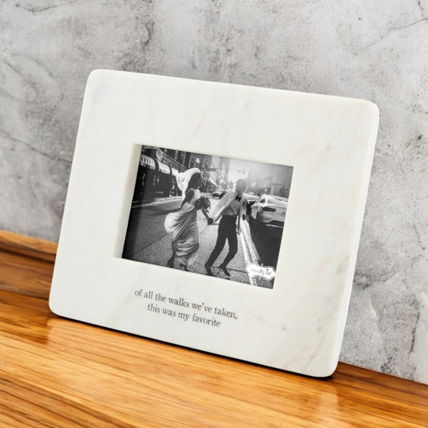 Elegant marble picture frame standing on an easel, engraved with the quote "Of all the walks we've taken, this was my favorite," displaying a 4x6 wedding photo for a timeless keepsake.