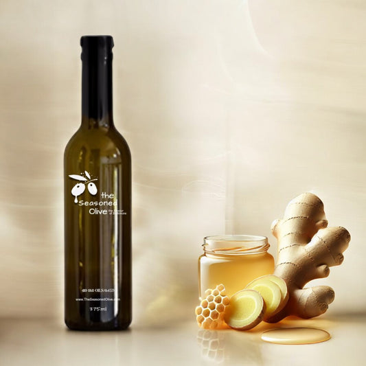 Elegant ivory cream background featuring sliced ginger root and a honey drizzle, creating a fresh and refined display that highlights the sweet and spicy essence of Honey Ginger White Balsamic Vinegar