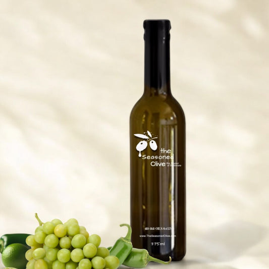 Jalapeño Lime White Balsamic Vinegar bottle with an ivory cream background, highlighting its zesty and spicy flavor profile