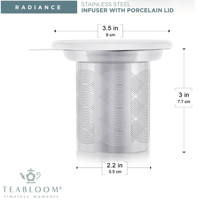 "Teabloom Universal Tea Infuser made of 18/8 stainless steel with a detailed perforated design and a porcelain lid, displayed on a white background."